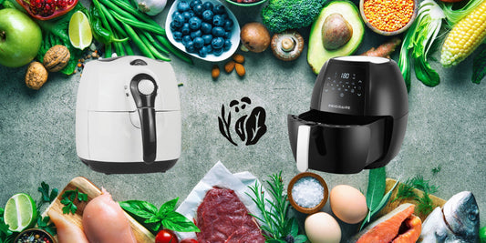 A one basket air fryer and a two basket air fryer surrounded by fresh produce and ingredients on a gray surface.