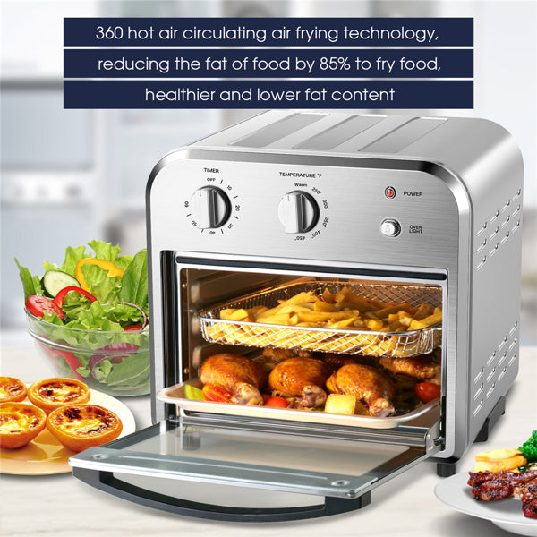 Easy to clean air fryer with food inside, surrounded by vegetables and dishes on a kitchen counter.