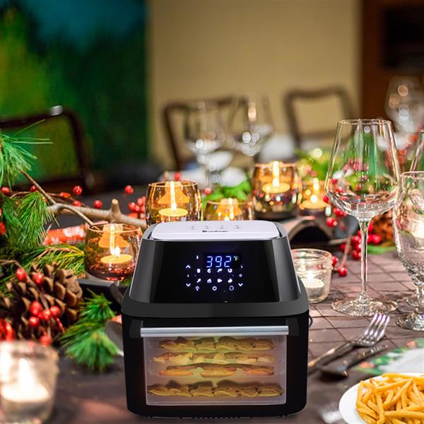 Large air fryer with dehydrator on a table with Christmas decorations and food.